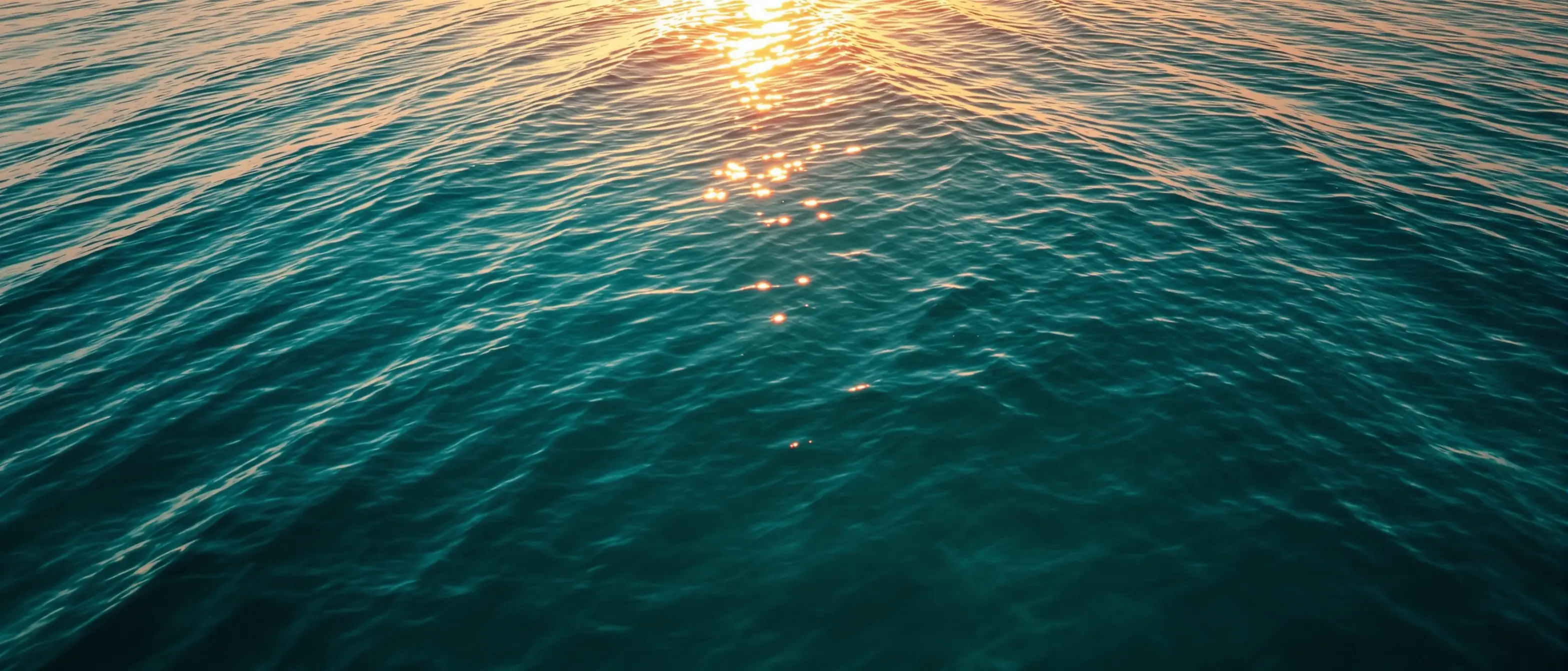 Calm open ocean at golden hour representing a fresh start with GLP-1 care through Open Water Rx
