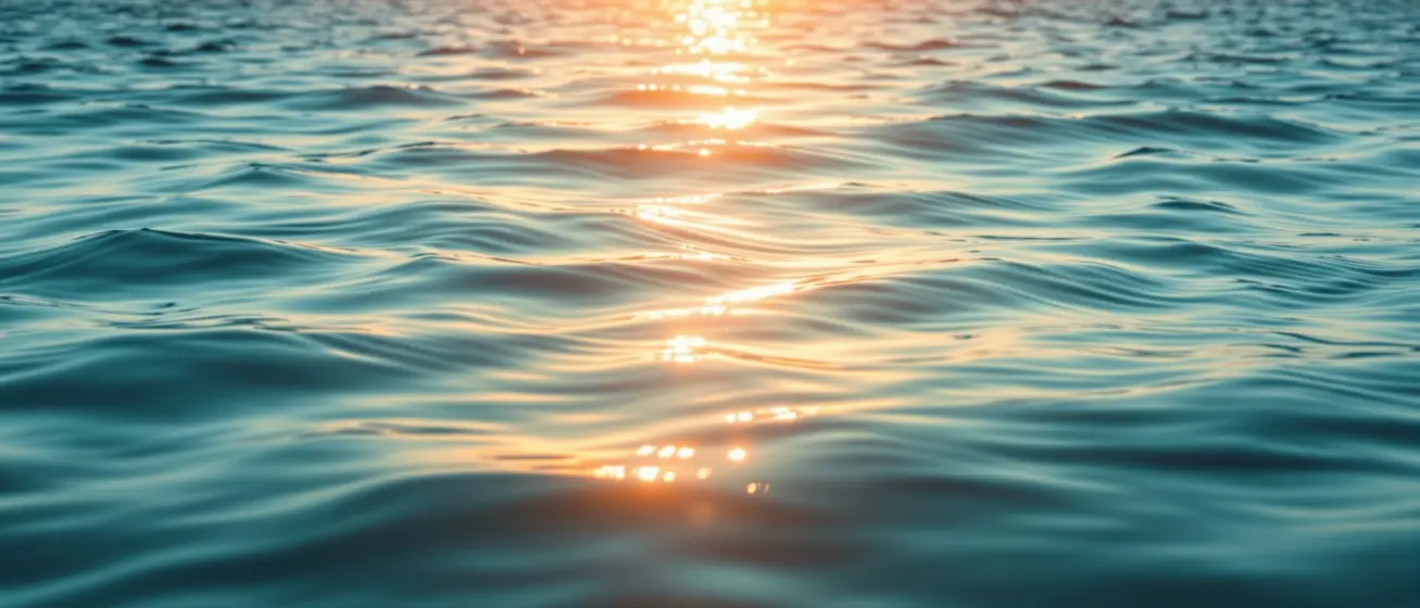 Calm teal ocean at sunrise representing informed, careful health decisions