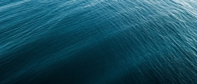 Deep teal ocean water at dawn with gentle ripples — decorative background for GLP-1 medication discontinuation guide